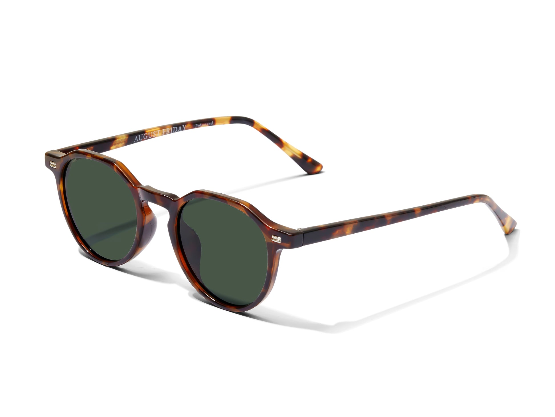 Sunglasses with tortoiseshell frame and dark lenses on a white background - Asian Fit Low Bridge Fit sunglasses - angled view